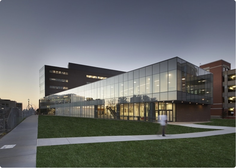 UHSP's Academic and Research Building, beautifully lit as the sun rises.