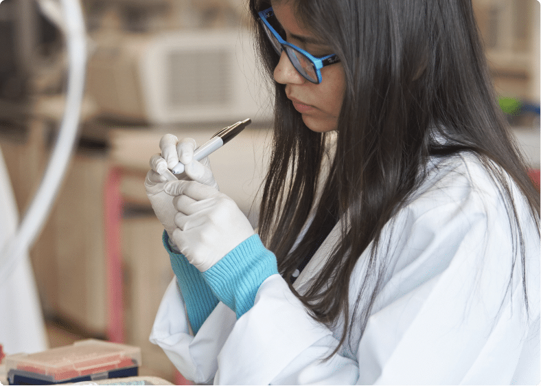 student labeling a sample in a lab