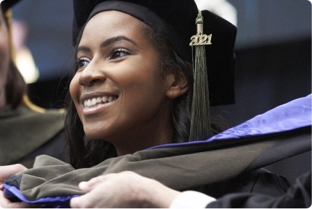 African american women smiling during commencement ceremony