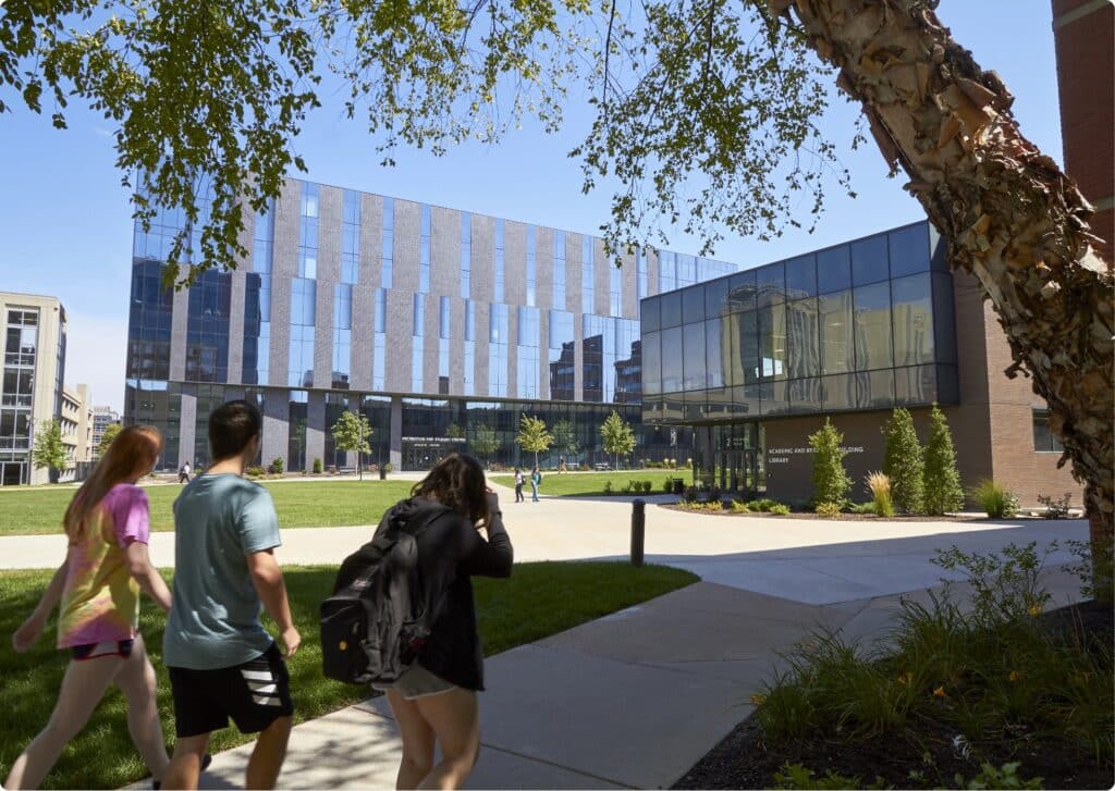 Quad-Students walking along sidewalk