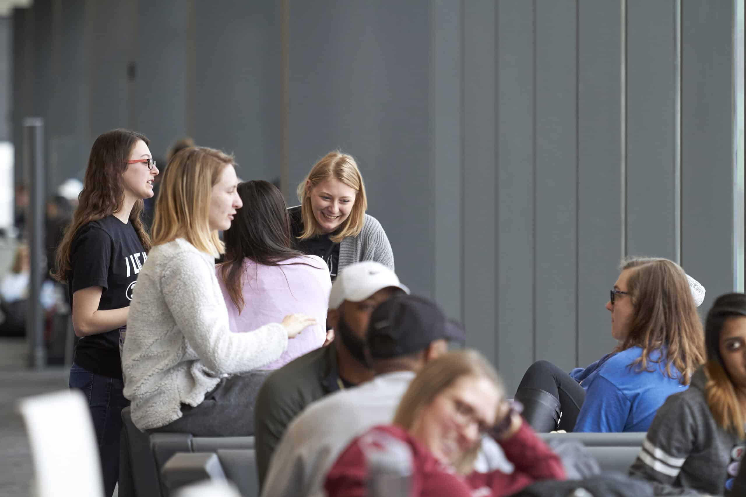 Group of students socialize in the ARB lounge.