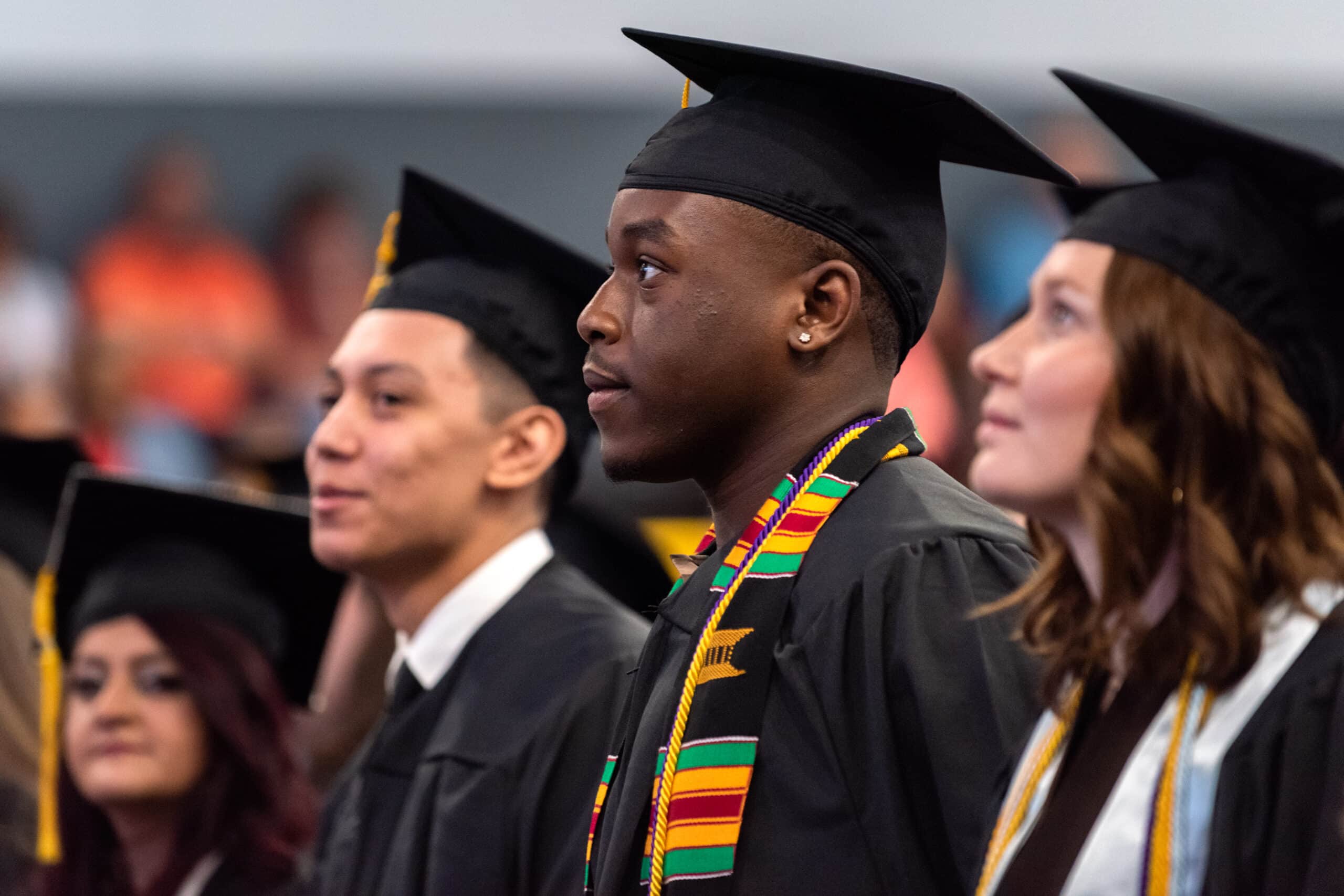 Students look on during undergraduate commencement ceremony