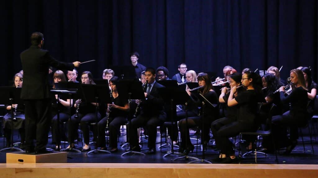 The concert band performs on the UHSP auditorium stage
