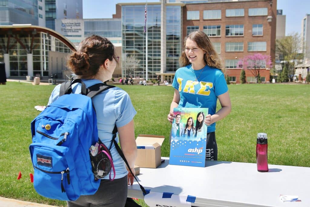 A student learns more about an organization on campus