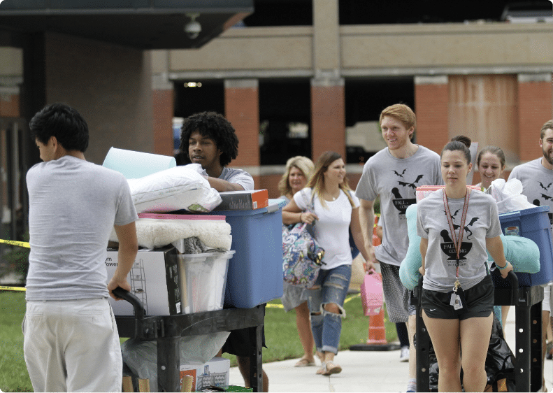 Move-In-Day-Students-walking-with-carts-full-of-items