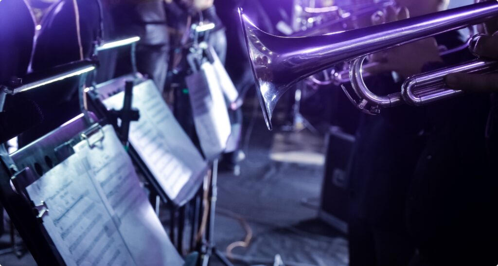 Orchestra music stands. Performance on the stage of a brass symphony orchestra