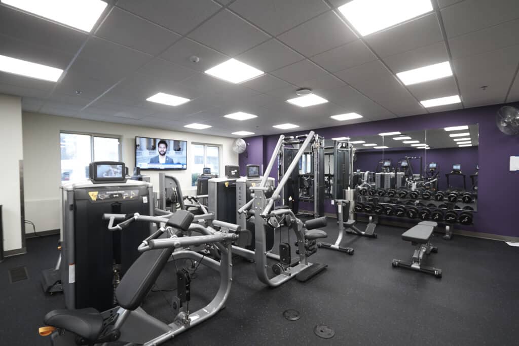 Exercise machines and free weights available in the South Residence Hall's gym at UHSP