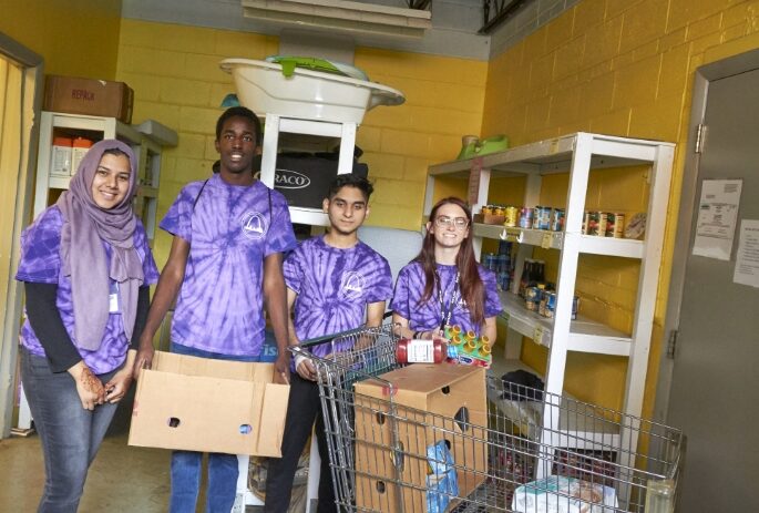 Freshmen students performing community service