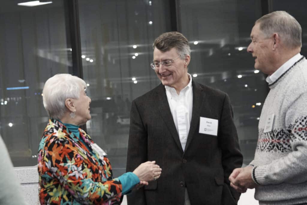 David Allen speaking with alumni at M&P event