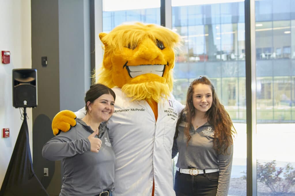 Students pose with Morty the Mascot during UHSP Preview Day