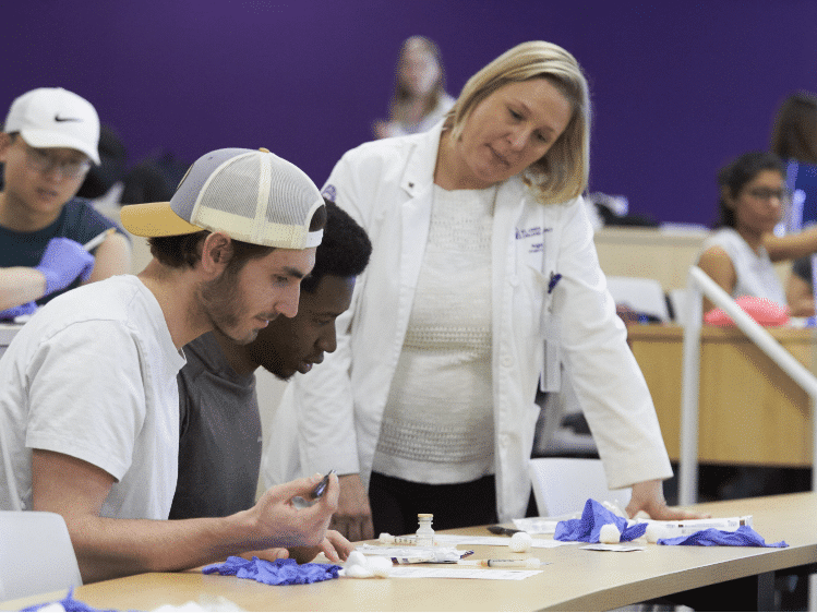 Pharmacy professor mentors two student pharmacists