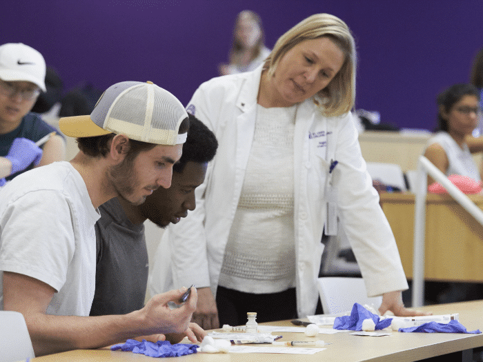 Pharmacy professor mentors two student pharmacists